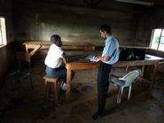 Austin Walker '12 talks with a Kenyan student.